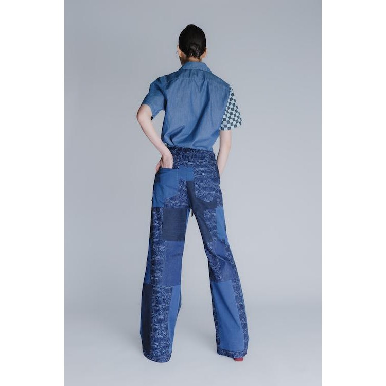 The "patch-mix" flared leg iconic recycled denim pants in blue